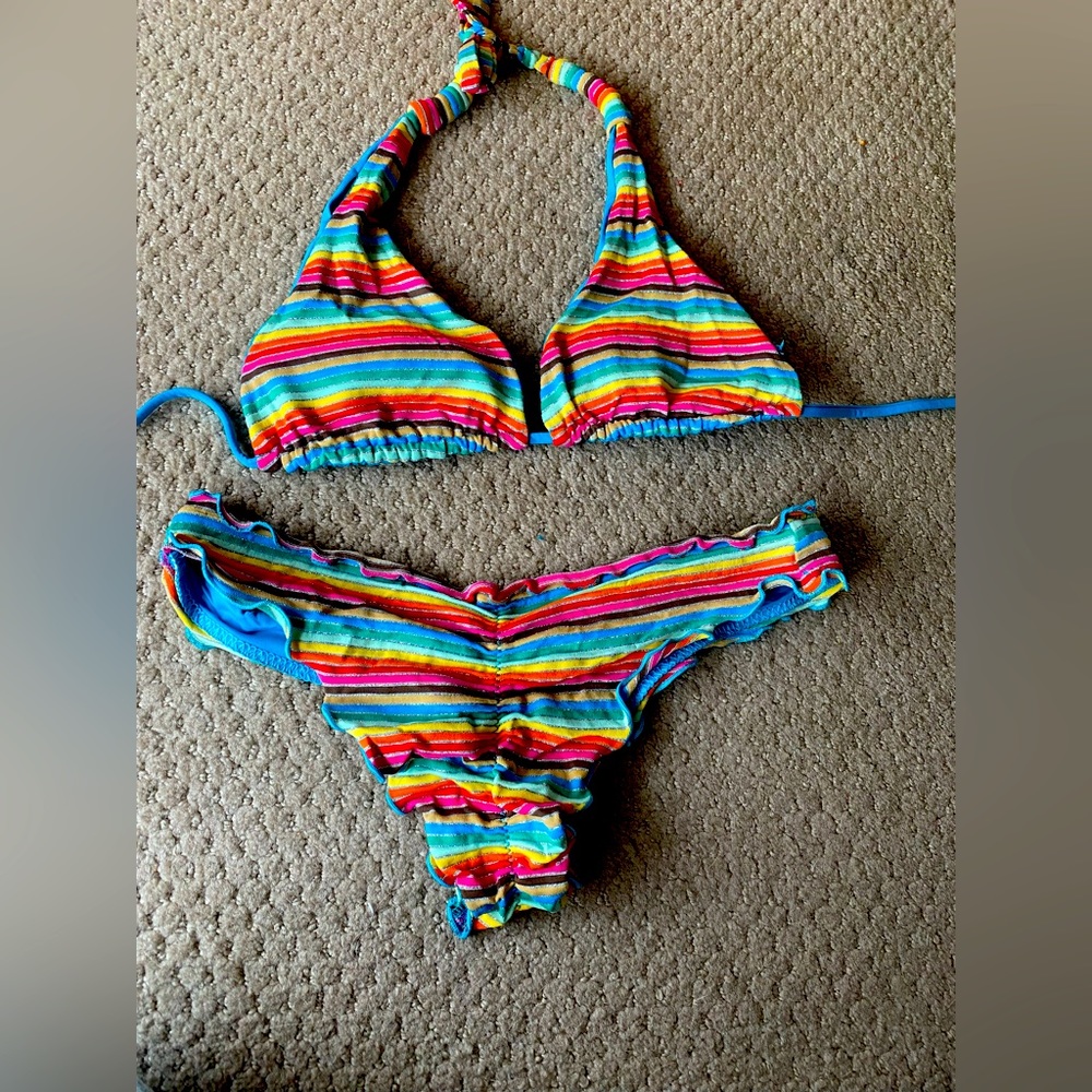 Size small vitamin A swimsuit. Top is reversible to a royal blue.